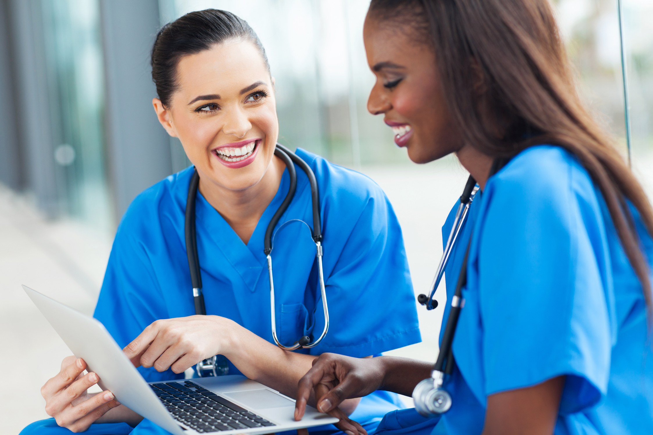 young female nurses having fun with laptop